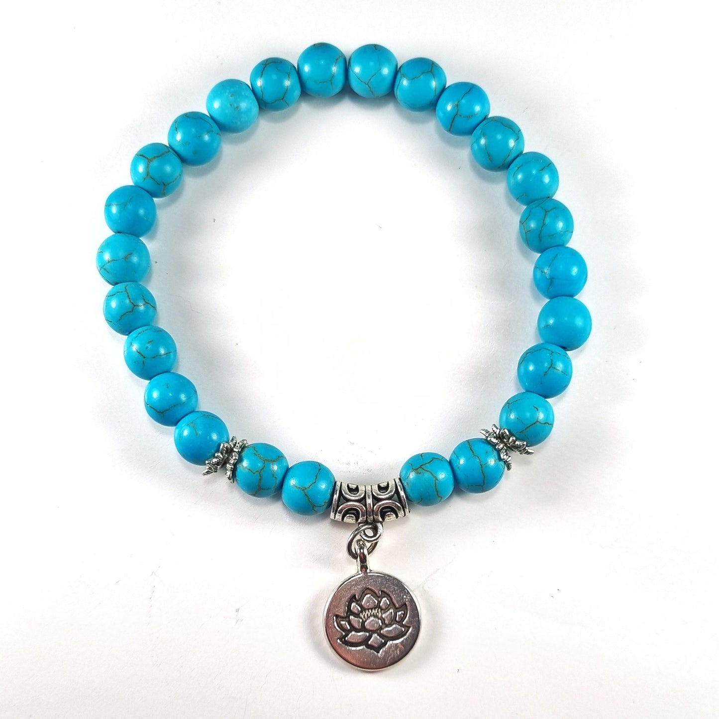 Pulsera piedra natural howlita celeste con dije de loto